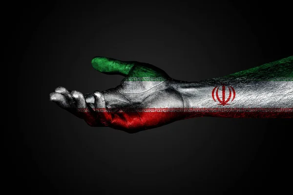 Una mano extendida con una bandera de Irán pintada, un signo de ayuda o —  Fotos de Stock