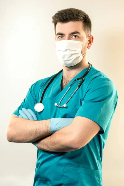 young male doctor in a mask from viruses.
