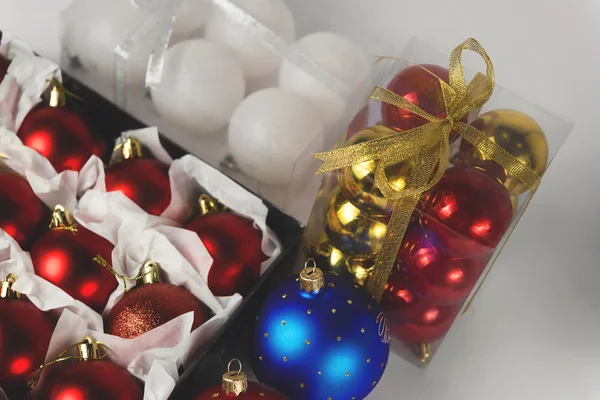 Set of Christmas toys in the box with colorful confetti — Stock Photo, Image