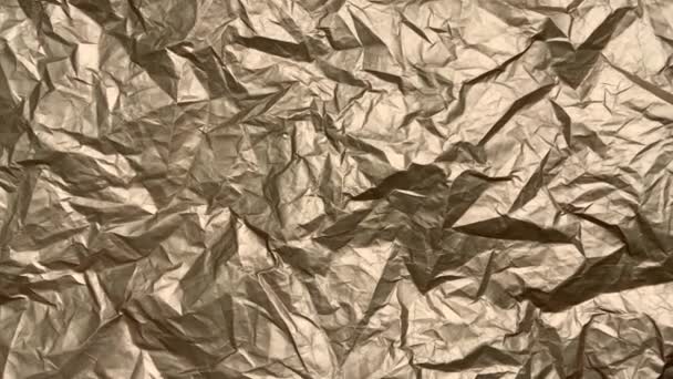 Crumpled Gold Paper Shimmers Sparkles Light Chaotic Movement Background — Stock Video