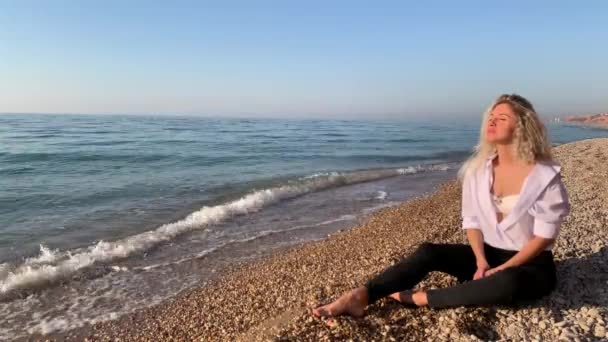 Beautiful Blonde Woman Sitting Meditating Beach Waves Blue Sea Crimea — Stock Video