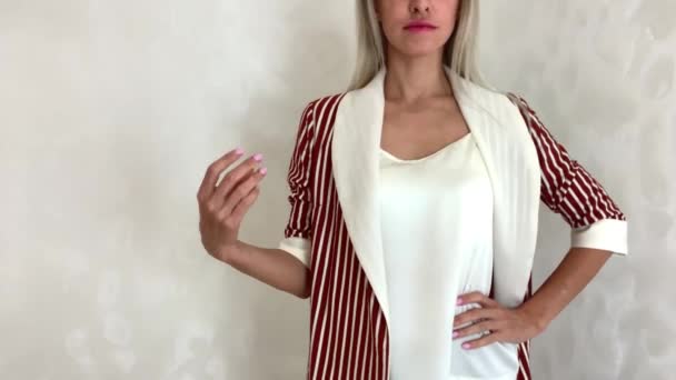 Woman Changes Clothes Click Finger Jackets Different Colors Variety Choices — Stock Video