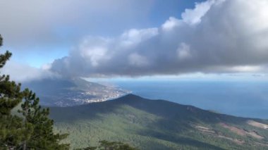Beautiful panoramic view of Mount Ai-Petri. Mountains, clouds, sea, trees.