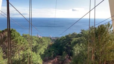 Cableway on Mount Ai Petri. The booth is slowly approaching. Ascent to the mountain.