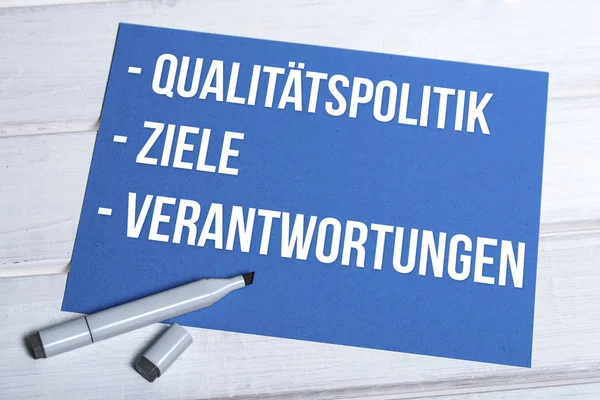Qualittspolitik Ziele Verantwortungen blue board with german — Stockfoto