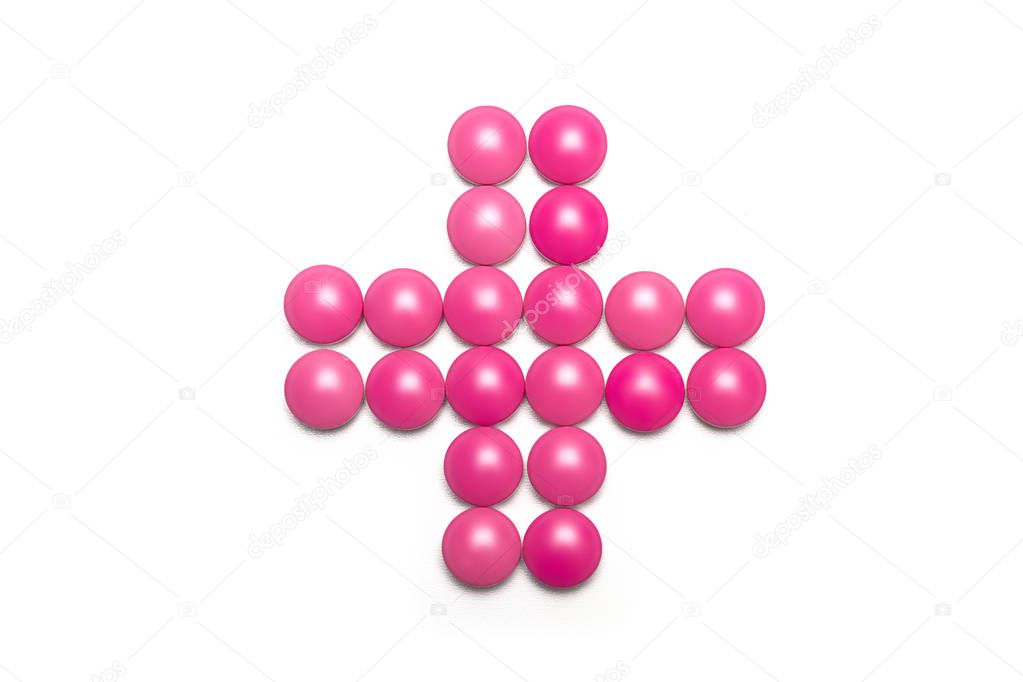 health cross made of pink purple pills 