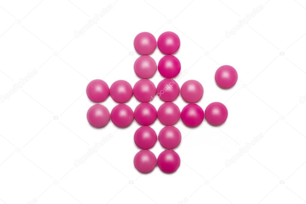 health cross made of pink purple pills 