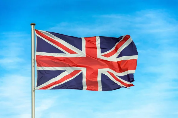 British union jack flag waggling in the wind with sky — Stock Photo, Image