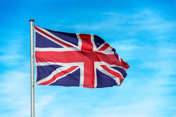 British union jack flag waggling in the wind with sky — Stock Photo, Image