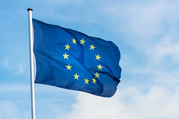 European flag waggling in the wind with blue sky — Stock Photo, Image