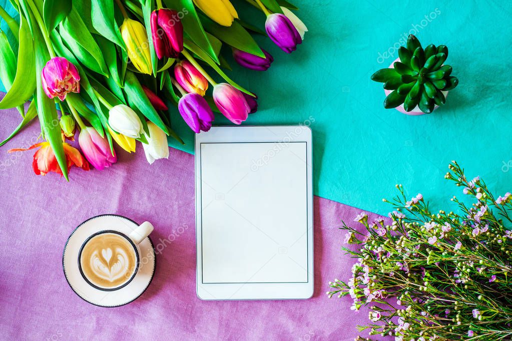 Blank tablet screen with free copyspace and easter and spring de