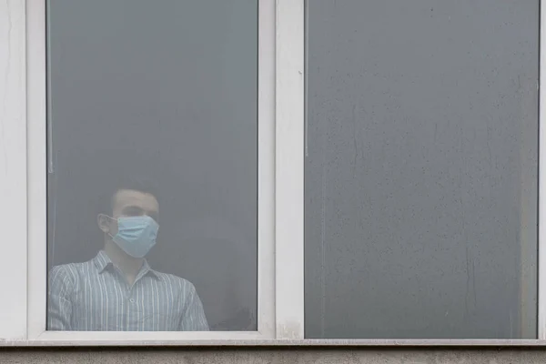 Young Man Wearing Face Mask Sick Covid Looking Window Quaranteened — Stock Photo, Image