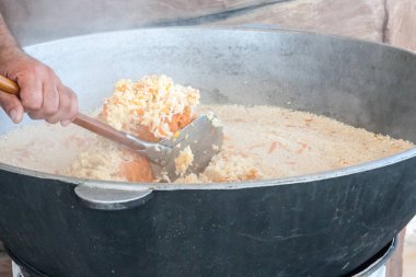 the cook mixes pilaf at preparation