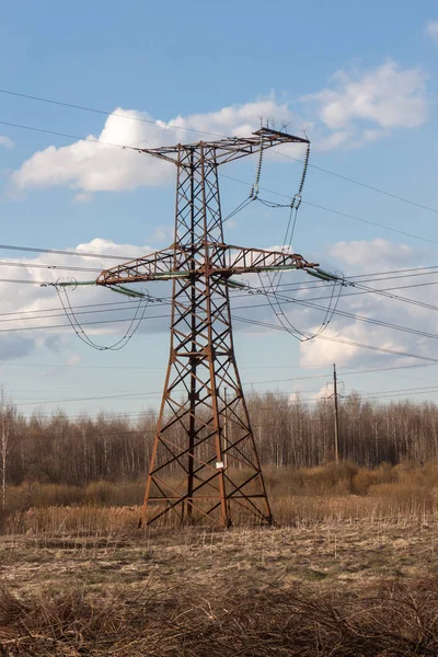 High-voltage electric main against the dark blue sky — Stock Photo, Image