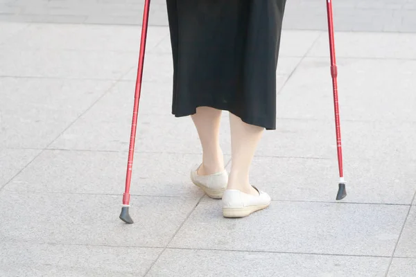 The woman is engaged in the Scandinavian walking — Stock Photo, Image