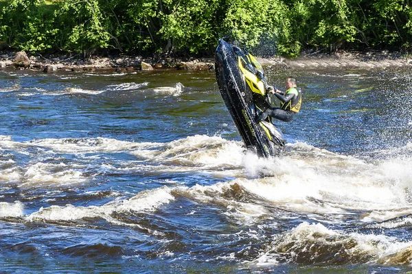 A man rides a water scooter along the Vuoks River — Stock Photo, Image