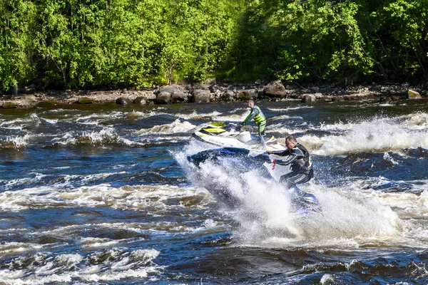 A man rides a water scooter along the Vuoks River — Stock Photo, Image