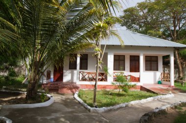 typical house near the beach of zanzibar clipart