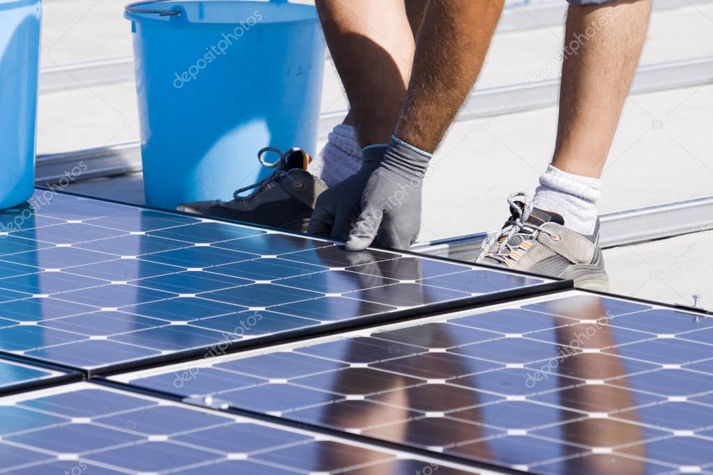 fitting photovoltaic panels on a roof  of a building