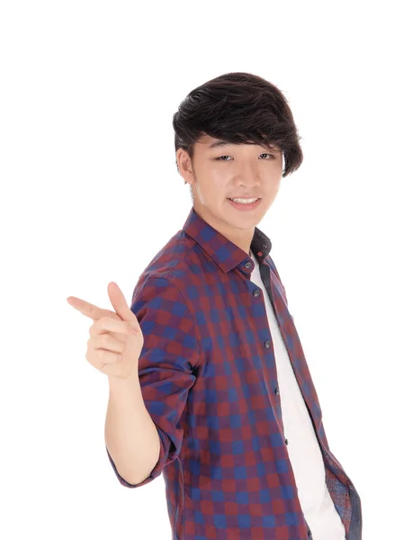 Asiatischer Teenager zeigt mit dem Finger. — Stockfoto
