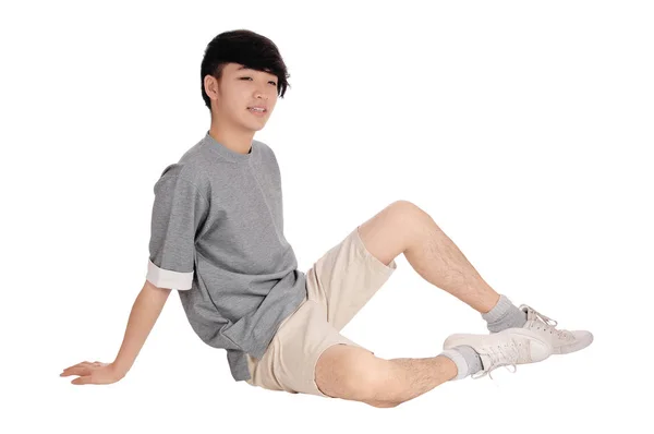 Asien tonåring sitter på golvet. — Stockfoto