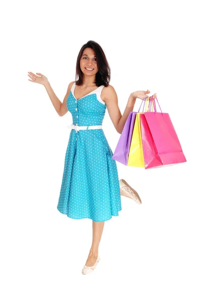 Beautiful Hispanic woman with shopping bags. — Stock Photo, Image