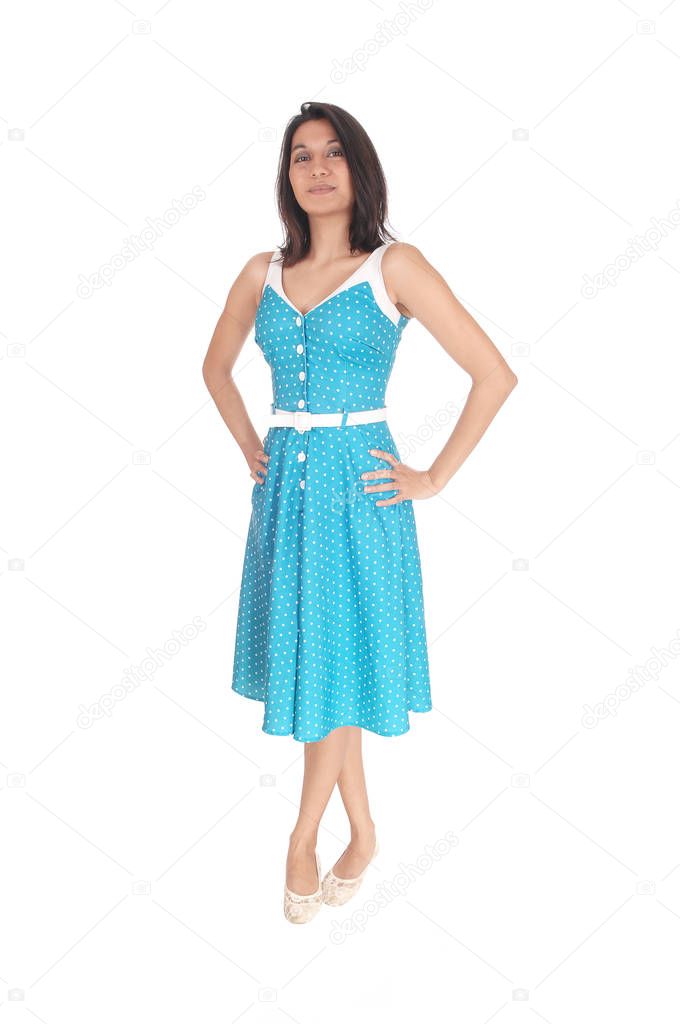 Beautiful Hispanic woman standing in blue dress.