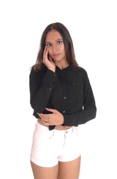 Young smiling woman standing in shorts — Stock Photo, Image