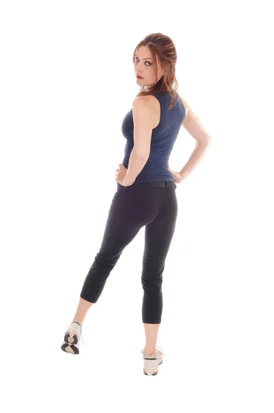 Woman standing in exercising outfit from back — Stock Photo, Image