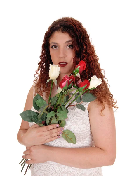 Woman in beige dress holding some rose — Stock Photo, Image