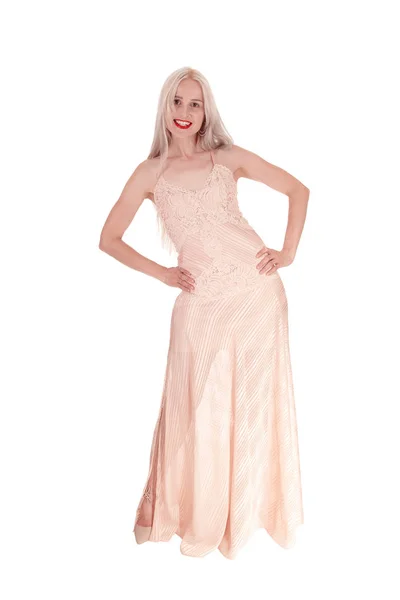 Beautiful woman in light pink evening dress — Stock Photo, Image