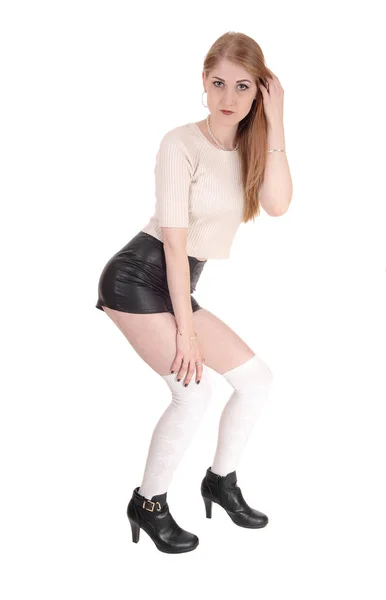Beautiful woman in leather shorts — Stock Photo, Image