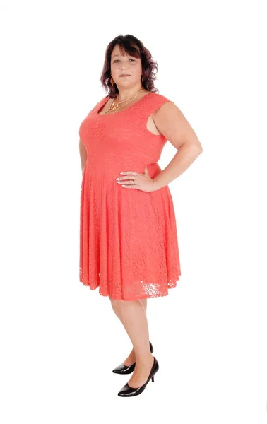 A plus size woman standing in a dress — Stock Photo, Image