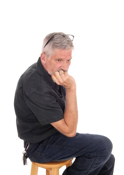 Middle aged man with hand on chin — Stock Photo, Image