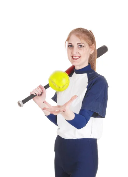 Woman catching the yellow softball — Stock Photo, Image