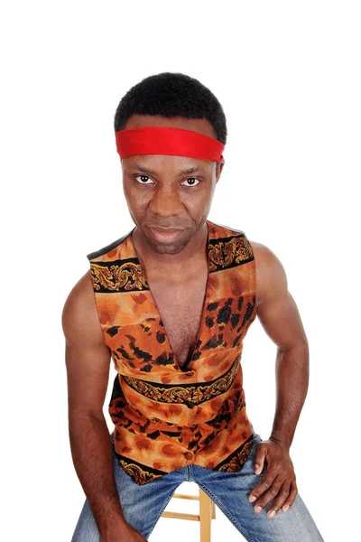 Serious looking African man in a vest — Stock Photo, Image