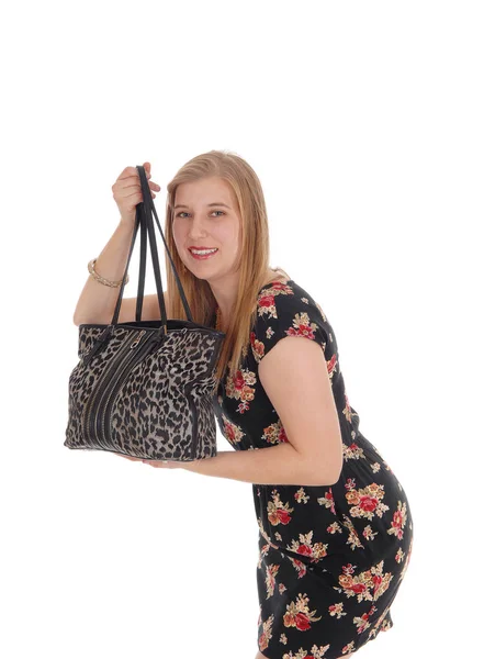 Young pretty woman standing her handbag — Stock Photo, Image