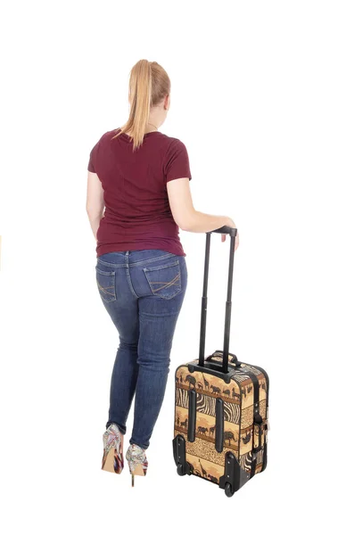 Woman standing from back with suitcase — Stock Photo, Image