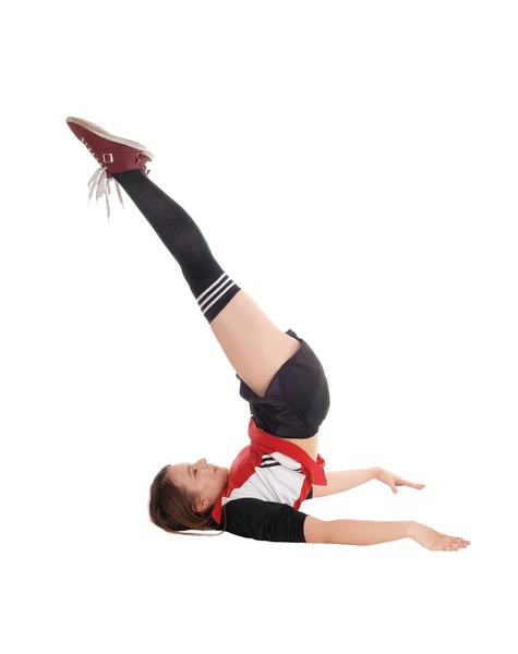 Young woman with gymnastics on floor — Stock Photo, Image