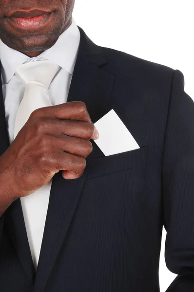 Černý muž uvedení vizitka v kapse — Stock fotografie