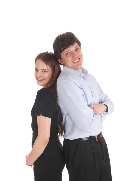 Young couple standing back to back — Stock Photo, Image