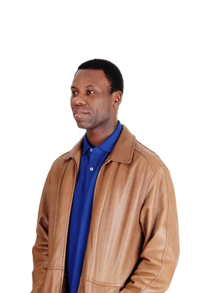 Serious African man standing in leather jacket — Stock Photo, Image