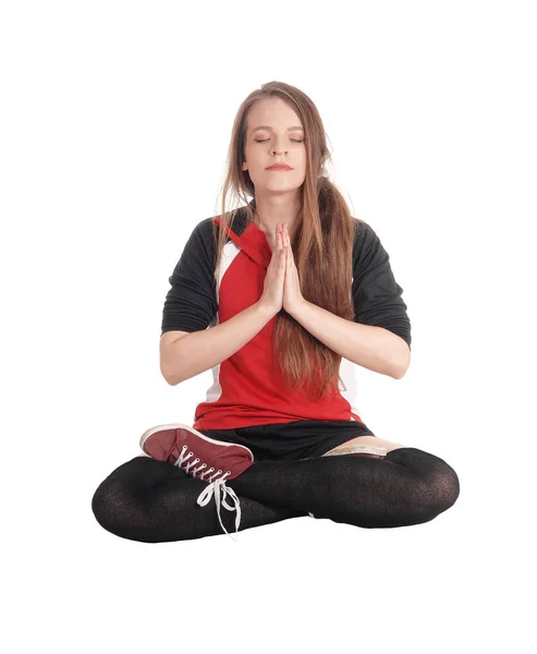 Beautiful woman sitting in joga pose — Stock Photo, Image