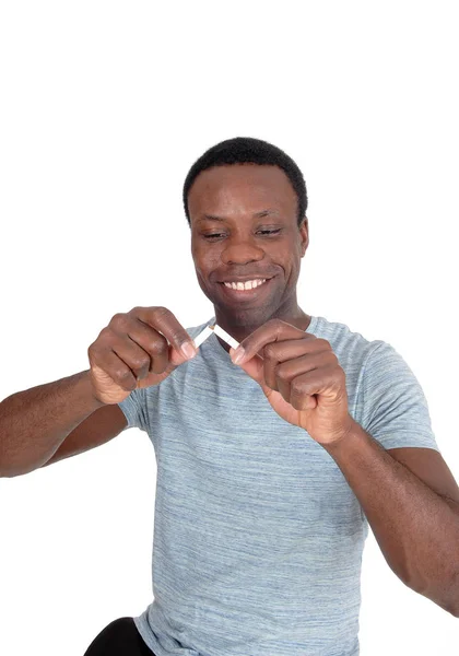Happy African man breaking a cigarette — Stock Photo, Image