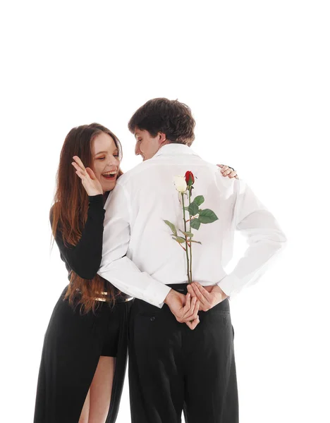 Man surprising girlfriend with red rose — Stock Photo, Image