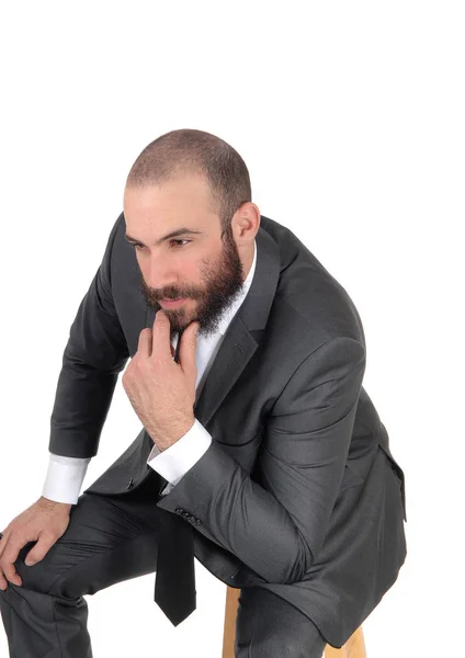 Business man with hand on chin thinking — Stock Photo, Image