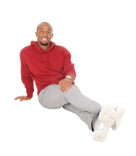 African man sitting on floor resting — Stock Photo, Image