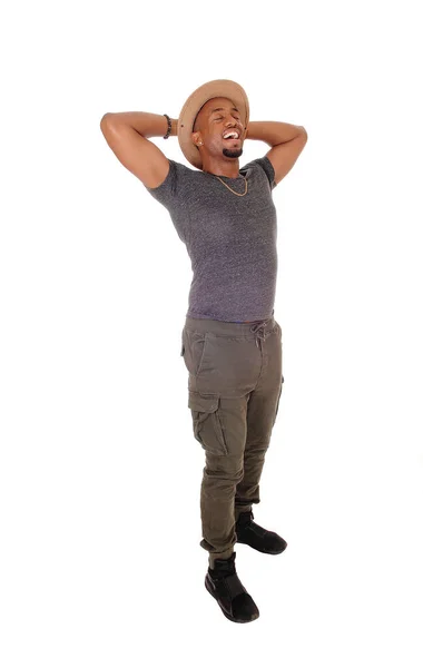 Happy African Man standing with his hands behind his head — Stock Photo, Image