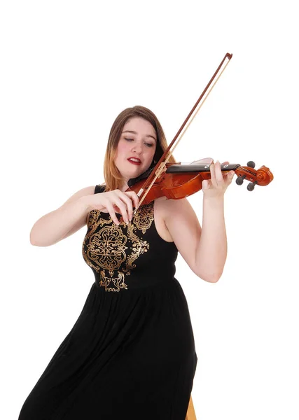 Woman sitting in a long black dress playing the violin — Stock Photo, Image