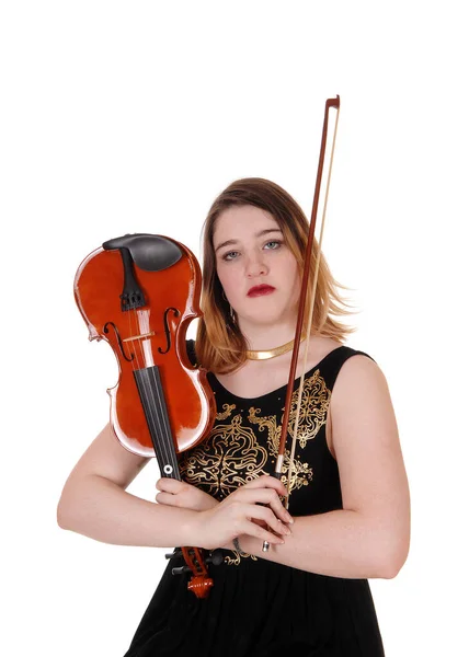 Woman holding up her violin in a black dress — Stock Photo, Image